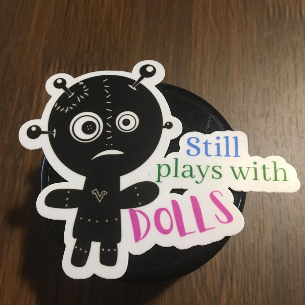 Still plays with dolls glossy vinyl sticker